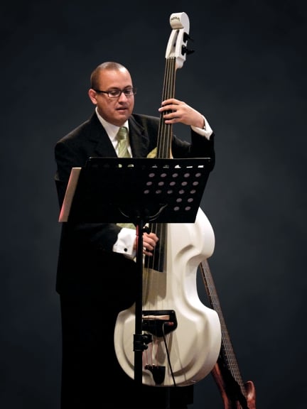 Daniel Menjívar playing Baby Bass